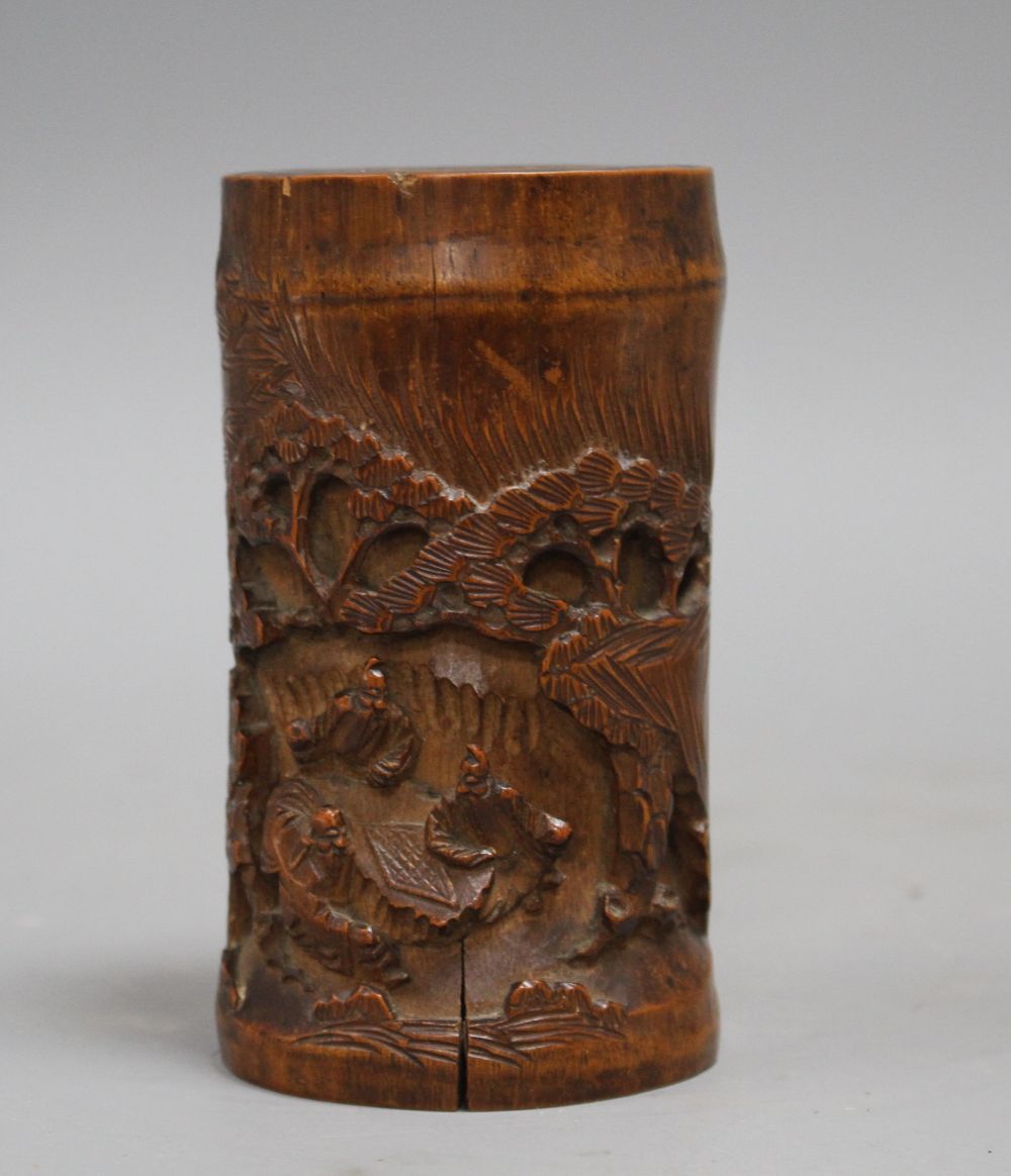 A Chinese bamboo brush pot, carved with scholars playing weiqi, late 19th/early 20th century H. 11.7cm